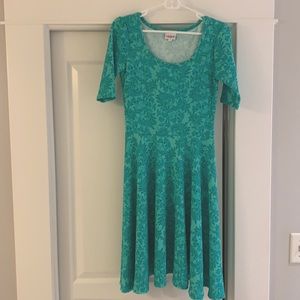 Lula Roe knee length green dress.